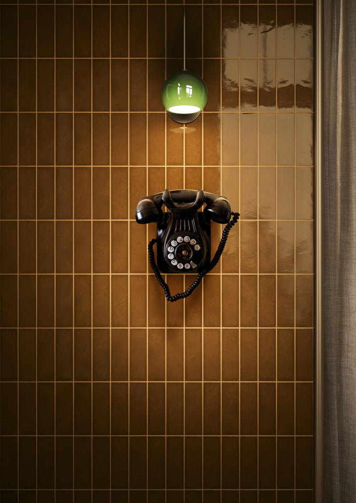 Interior wall finished with Quintessenza Amarcord Tabacco glossy porcelain tiles