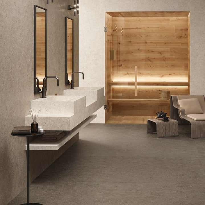 Boost Stone Clay stone-effect porcelain wall tile in a wellness spa bathroom
