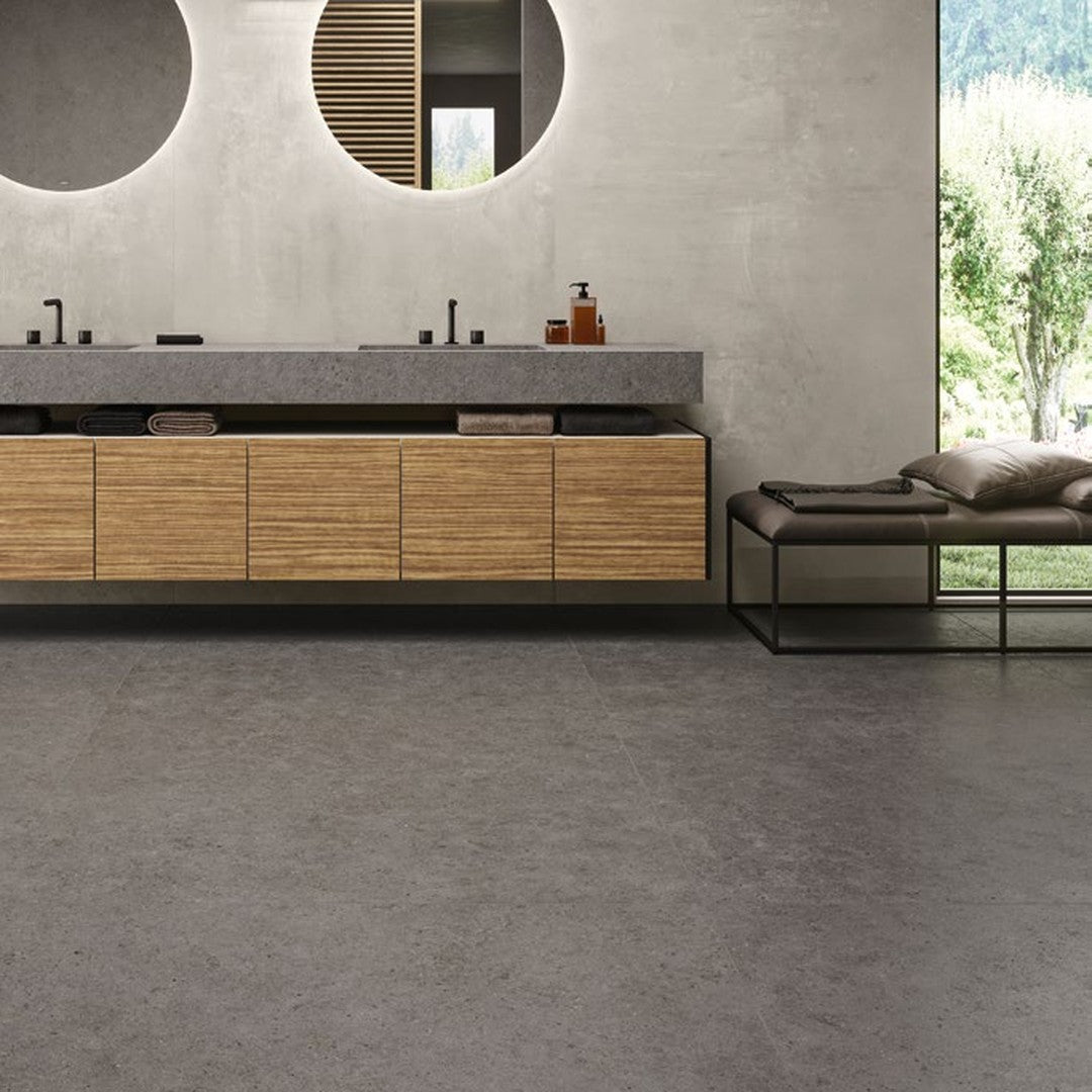 Boost Stone Smoke stone-effect porcelain wall and floor tile in a commercial restroom