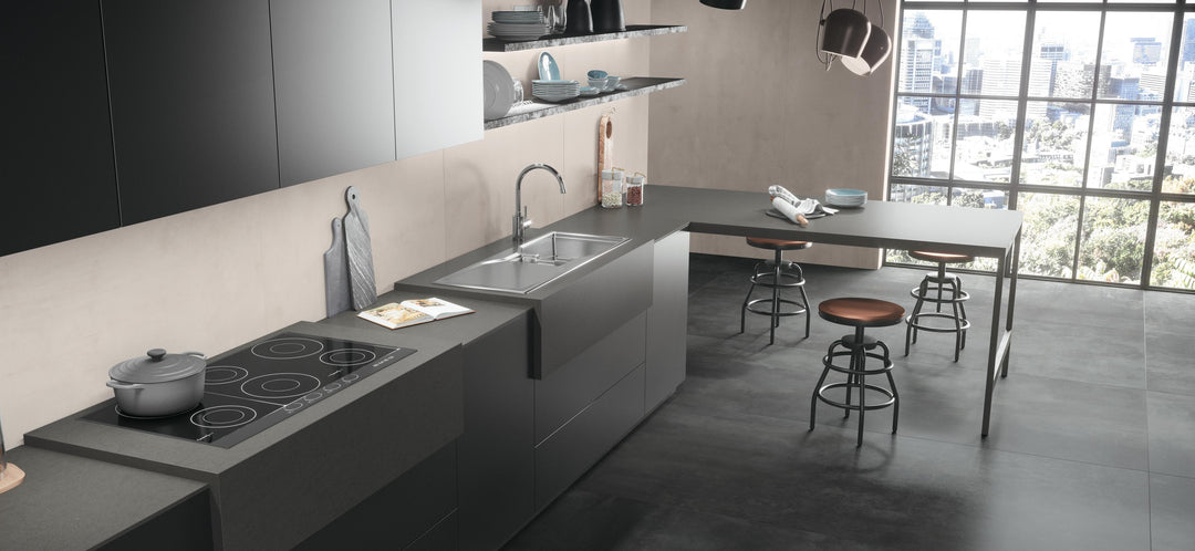 Boost Tarmac and Pearl concrete effect porcelain tiles in a modern kitchen