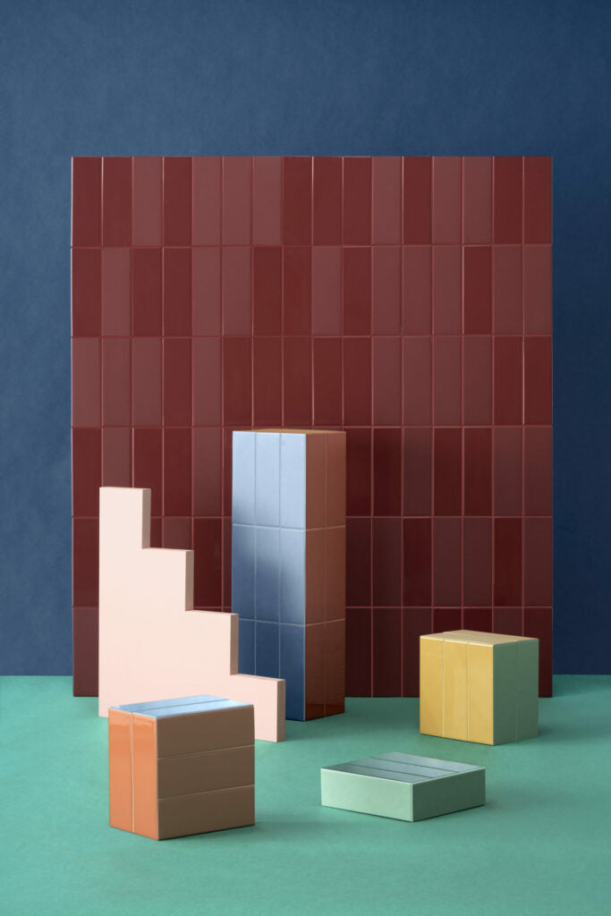 Quintessenza Färgblock porcelain tiles in a colourful architectural composition